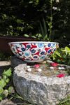 Handmade and colorful ceramic bowl in white with red and blue bright colored flowers, inspired by Turkish style and history. Lead free and food safe quality