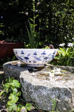 Handmade ceramic bowl in white with stunning blue floral motifs