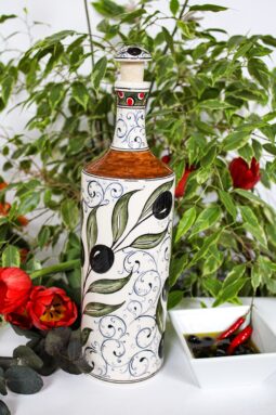Elegant handmade olive oil bottle in beautiful ceramics. Decorated with olive branches in black, green and golden colors.