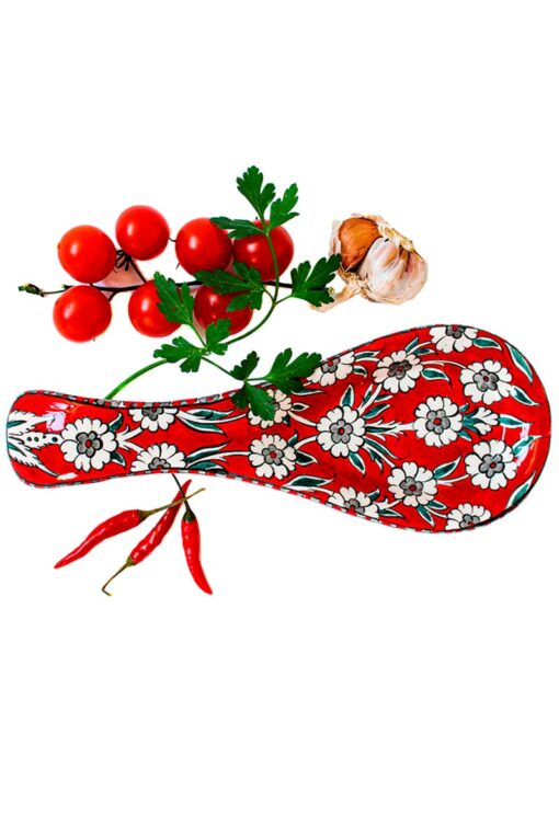 Unique spoon holder in a hot red color with lovely floral motifs. Perfect for resting your kitchen gear while cooking. Foodsafe ceramics