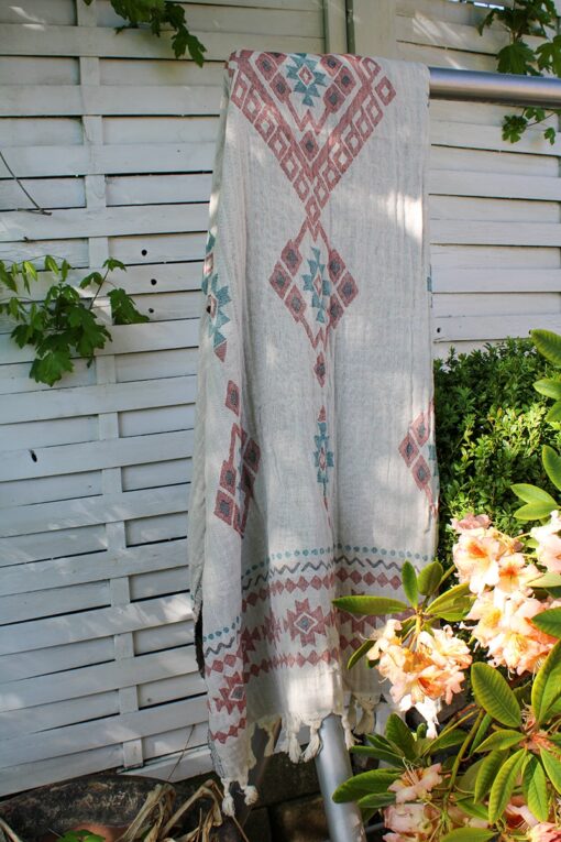 Organic peshtemal towel with colorful geometrical patterns in jacquard design. Useable on both sides