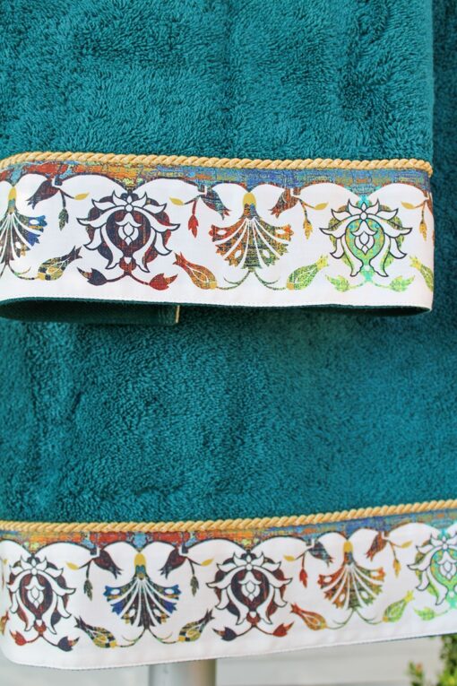 Printed border ornamenting an exclusive towel set with gorgeous floral motifs in various dusty colors